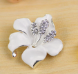 Elegant Silver-Tone White Enamel Floral Brooch with Crystal Accents
