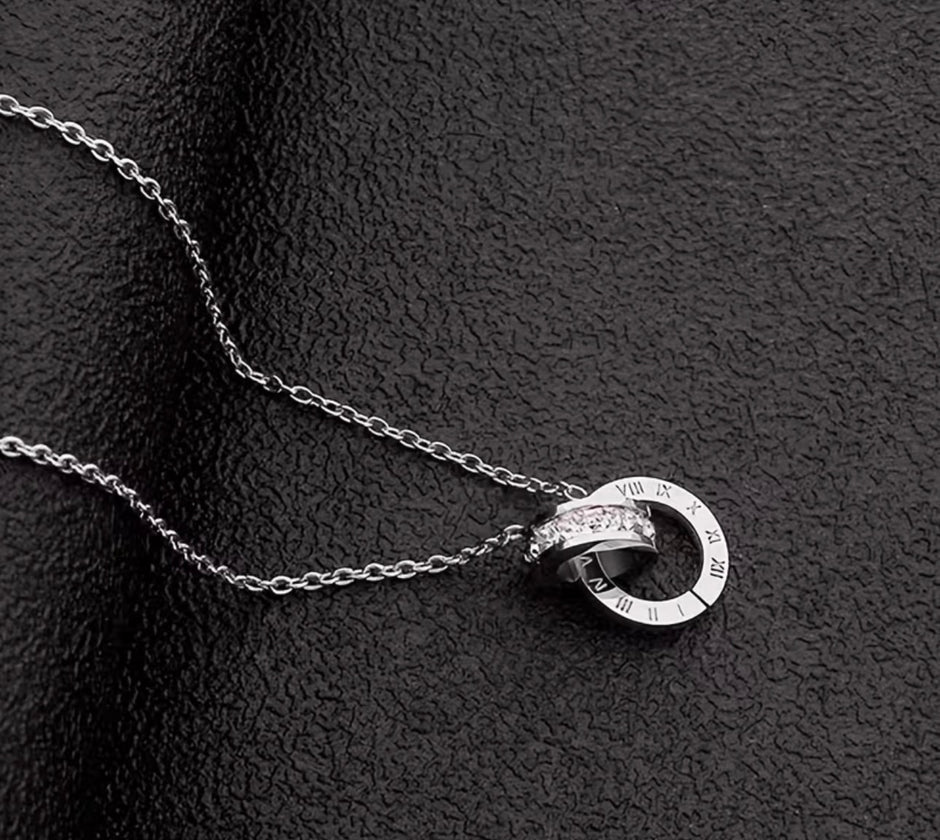 Elegant Stainless Steel Interlocking Ring Crystal Pendant Necklace