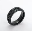 Black metal ring with chain design on a white background